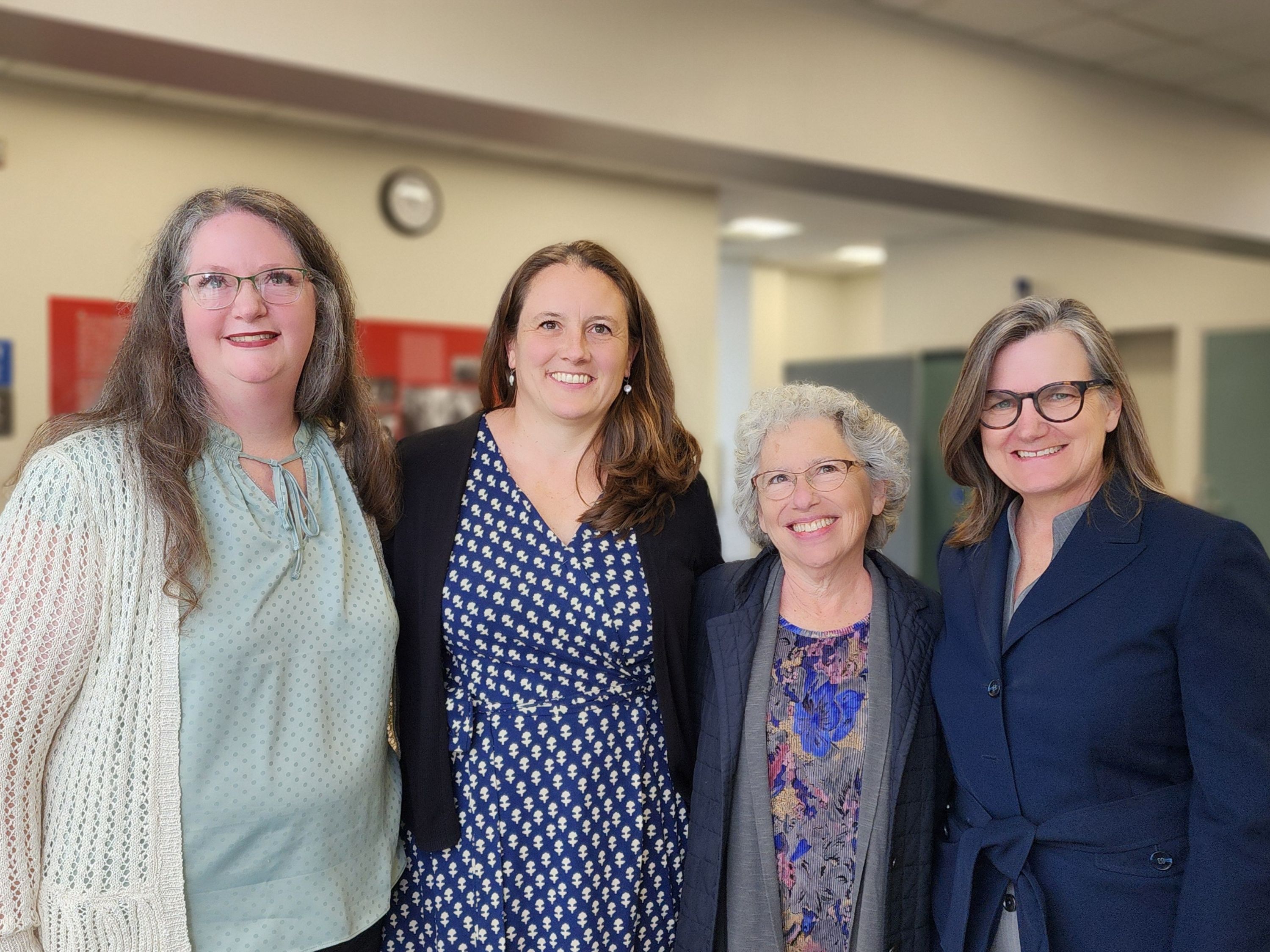 Mary Hartley, Erin Johnson, Rachel Mann, and Emma Schmidt pose after testifying