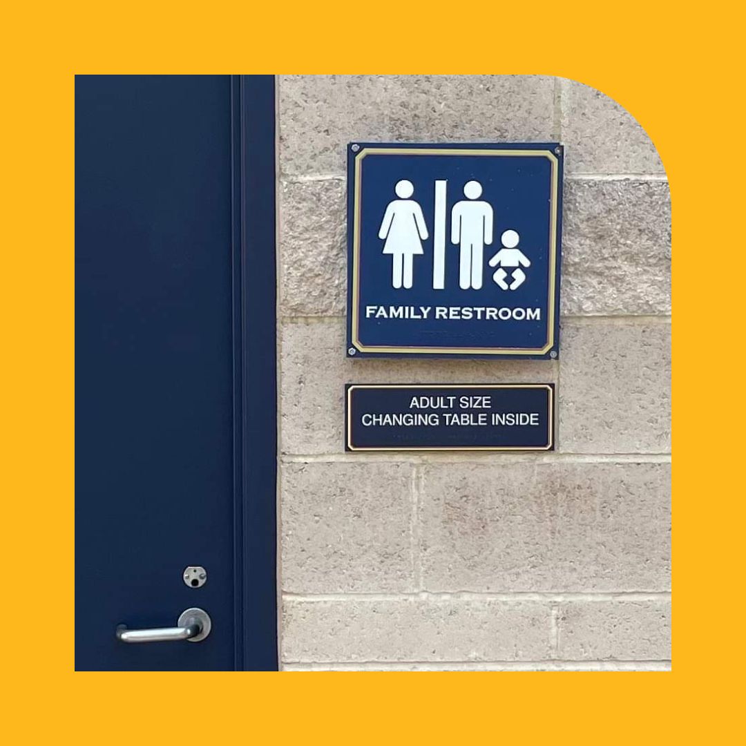 Family Restroom Sign indicates the availability of an adult size changing table.