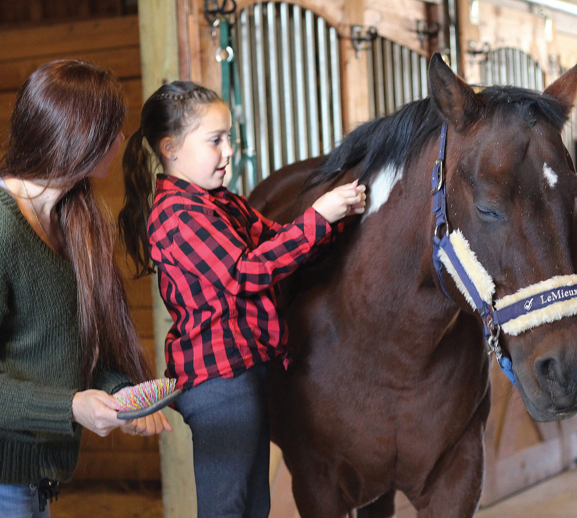 Young female experiences equine therapy